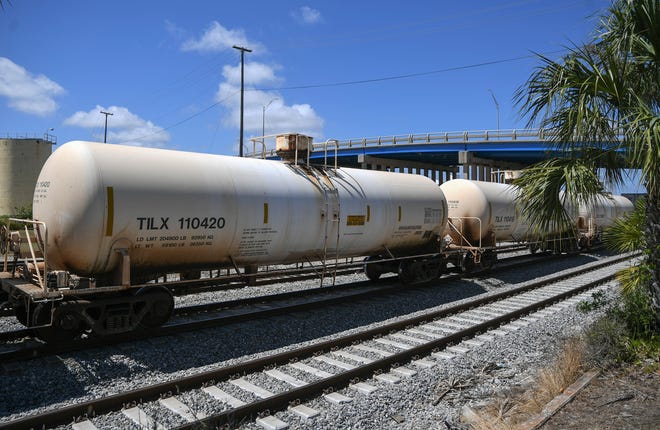 Several railroad tanker cars are seen on a slow-moving train moving south on a side track under the Citrus Boulevard bridge Wednesday, March 22, at the Florida East Coast Railway Fort Pierce Yard.