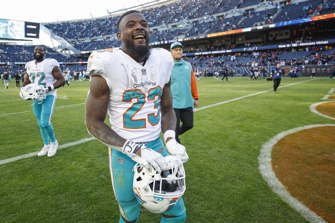 Miami Dolphins running back Jeff Wilson Jr. (23) walks off the field after an NFL football game against Chicago Bears, Sunday, Nov. 6, 2022, in Chicago. (AP Photo/Kamil Krzaczynski)