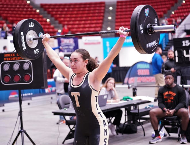 Treasure Coast's Aliciana McCloyne competes in the clean-and-jerk event as part of the Olympic lifts portion of the FHSAA Girls Weightlifting Championships that took place on Saturday, Feb. 18, 2023 at the RP Funding Center in Lakeland.