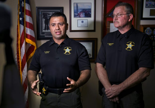 Capt. Ruben Romero (left) and Maj. John Cummings, both of the Martin County Sheriff's Office, on Wednesday, June 22, 2022, discuss a homicide in Palm City that was reported Tuesday evening on Southwest Honey Terrace. The suspect is considered to be armed and dangerous.