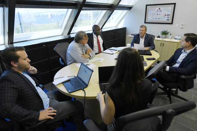 Eric Silagy, president and CEO of Florida Power & Light ; Gera Peoples, vice president and chief litigation counsel for NextEra Energy; and FPL spokesman David Reuter met in June with reporters from The Florida Times-Union, the Orlando Sentinel, and Floodlight News in Jacksonville to discuss the use of outside agencies to facilitate FPL's activities. [Bob Self/Florida Times-Union]