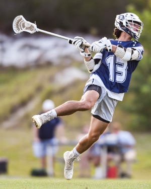 St. Edward's Ricky Savage (13) scores a goal against The Pine School in a high school boys lacrosse game Tuesday, March 22, 2022, at The Pine School in Hobe Sound. St. Edward's won 15-1.