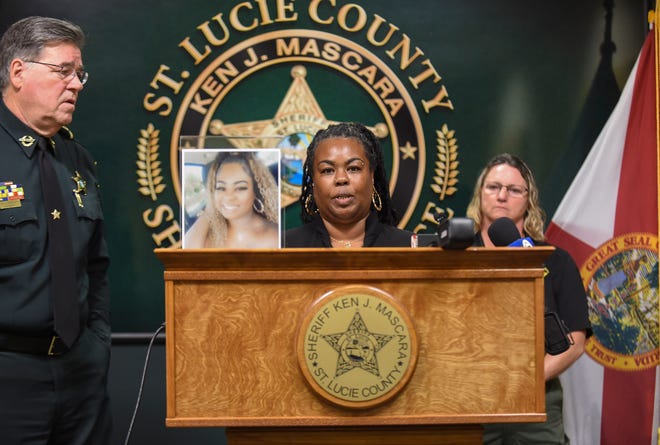 Nikkiti White (center), mother of Nikkitia Bryant, speaks during a press briefing at the St. Lucie County Sheriff's Office on Monday, March 20, 2023, discussing an arrest made in connection to the Jan. 16 murder of Bryant, who was shot and killed by a stray bullet at a Martin Luther King Jr. car show at Ilou Ellis Park in Fort Pierce. "I want to encourage more people to come forward with more information... so that anyone who has anything to do with this is arrested," White said.