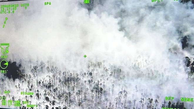 A wildfire broke out Thursday afternoon March  23, 2023, on the John C. and Mariana Jones/Hungryland Wildlife and Environmental Area off Pratt Whitney Road in Martin County near Indiantown. Image is from above the fire.