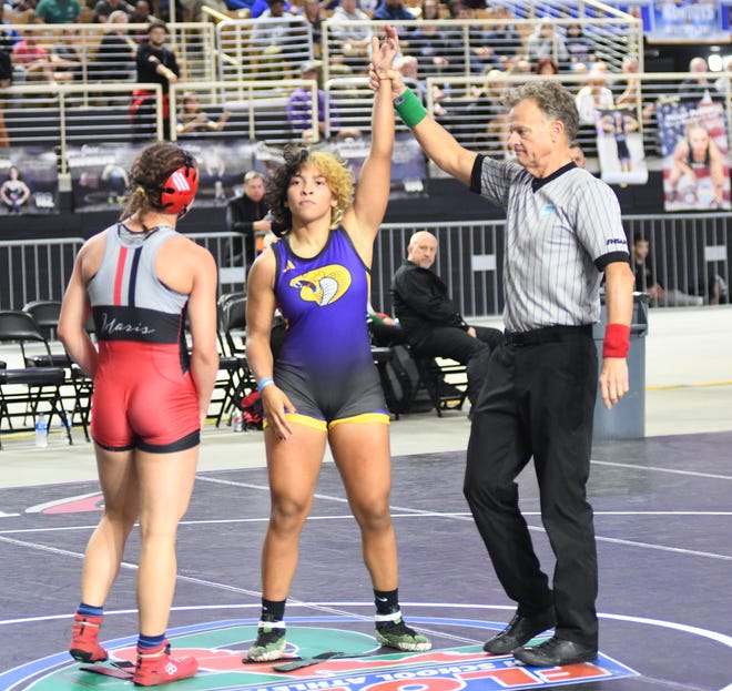Fort Pierce Central's Gaby Perez is signaled the winner over Satellite's Lucy Maris, left, in their 135-pound final Saturday, March 4, 2023, at the FHSAA State Wrestling Championships at the Silver Spurs Arena in Kissimmee. Perez won by fall in 3:30. (Lynn Ramsey/)