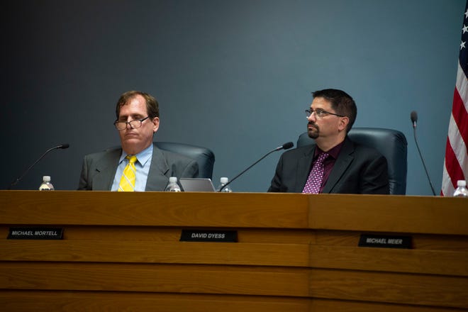 City of Stuart attorney Michael Mortell (left) and interim city manger David Dyess listen during a workshop discussing a Brightline station Monday, Sept. 17, 2018 at city hall in Stuart. Mayor Kelli Glass Leighton said the event was not a formal meeting, but simply a workshop for the benefit of the public. She suspected action will be taken during the first meeting in October.