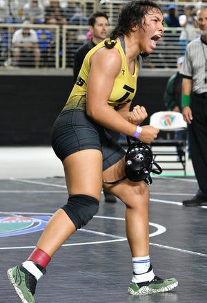 Gabriella Perez of Treasure Coast celebrates her victory over Tydaisa Mack of North Miami during the FHSAA State Wrestling Championships at Silver Spurs Arena in Kissimmee. Craig Bailey/FLORIDA TODAY via USA TODAY NETWORK