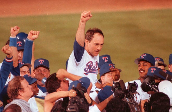FILE - Texas Rangers pitcher Nolan Ryan is carried off the field by his teammates after throwing his seventh no-hitter against the the Toronto Blue Jays in Arlington, Texas, May 1, 1991. Hall of Fame pitcher Nolan Ryan is the subject of a new documentary. (AP Photo/Bill Janscha, File)