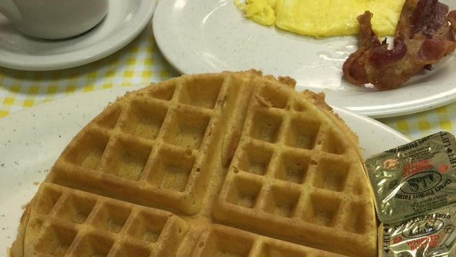 Kountry Kitchen's Belgian waffle with a scrambled egg and bacon. (MARIBETH RENNE/SPECIAL TO TREASURE COAST NEWSPAPERS)