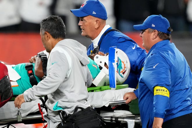 Dolphins quarterback Tua Tagovailoa is taken off the field after suffering a concussion on a sack by the Bengals' Josh Tupou in a Thursday night game in September.