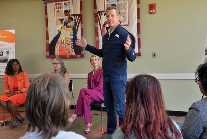 California Gov. Gavin Newsom speaks to students from New College of Florida about his recent week-long trip across the South, during Newsom's stop on Wednesday  at the Betty J. Johnson North Sarasota Public Library in Sarasota.