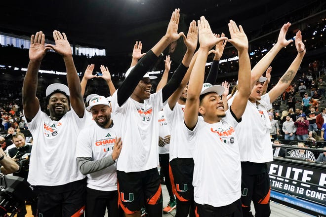 The Miami Hurricanes celebrate after defeating Texas in the Elite Eight.