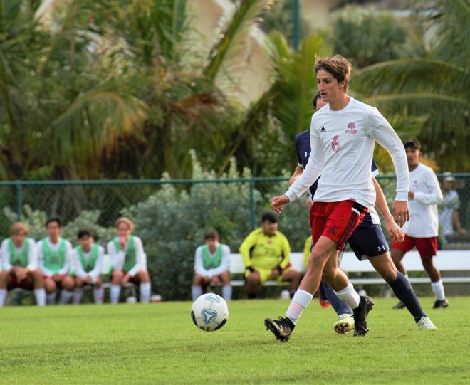 Vero Beach's Samuel Santoro looks for a teammate to pass to during a match against St. Edward's in the Indian River Cup on Dec. 16, 2022, in Vero Beach. Vero Beach won 2-1 in extra time.