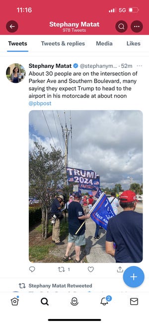 Some of the dozens of Trump supporters lining Southern Boulevard ahead of the former president's departure for Manhattan.