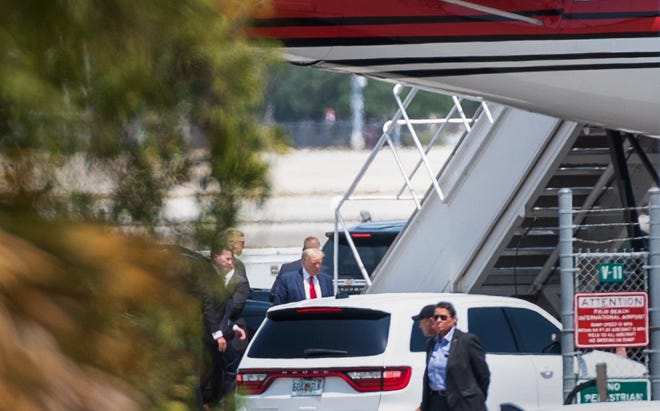 Former President Donald Trump ascends the stairs of his 757 at Palm Beach International Airport on Monday, April 3, 2023, in West Palm Beach, FL. Trump was departing for New York, where he faces arraignment on Tuesday.
