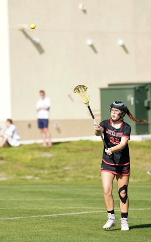 South Fork's Katie Hale passes to a teammate during a high school lacrosse game against Pine School on March 23, 2023 in Hobe Sound. South Fork won 15-3.