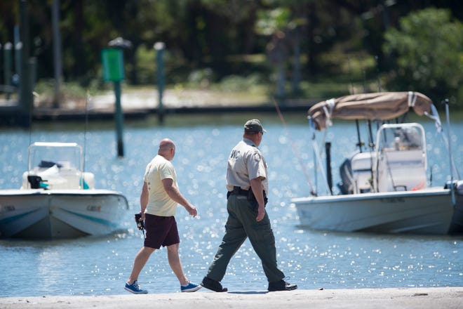 Florida Fish and Wildlife Conservation Commission Lt. James Fillip and Officer David Bingham investigate a two-boat collision in which Jensen Beach resident Matthew Jones died on April 3, 2018, near Sandsprit Park in Stuart.