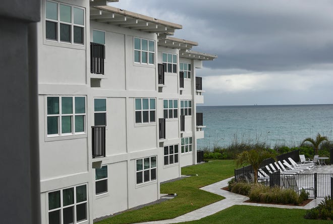 The new exterior look of the Ocean Club II Condominium in Vero Beach is seen with new resurfacing of exterior walls and windows, along with new landscaping and walkways.