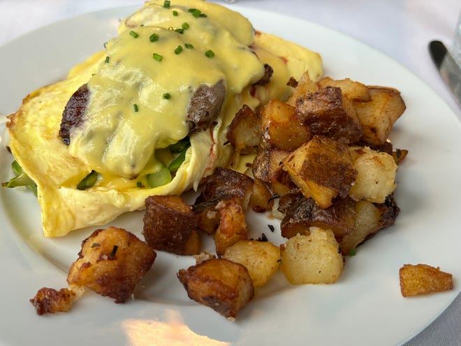 The Steak & Potato Omelet was savory and fluffy and topped with sliced, medium rare beef.