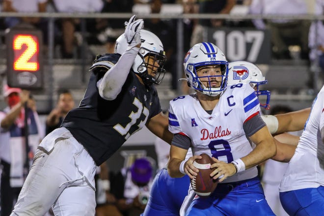 Oct 5, 2022; Orlando, Florida, USA; UCF Knights defensive lineman Tre'mon Morris-Brash (33) moves in for the sack against Southern Methodist Mustangs quarterback Tanner Mordecai (8) during the second half at FBC Mortgage Stadium. Mandatory Credit: Mike Watters-USA TODAY Sports