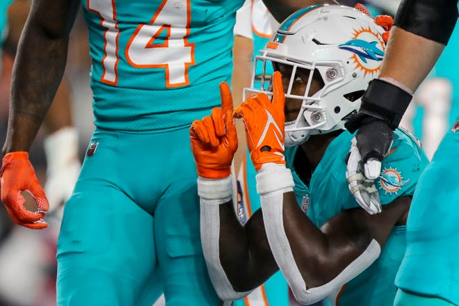 Dolphins running back Chase Edmonds, who has the team's only rushing touchdowns, reacts after scoring against the Bengals on Sept. 29.
