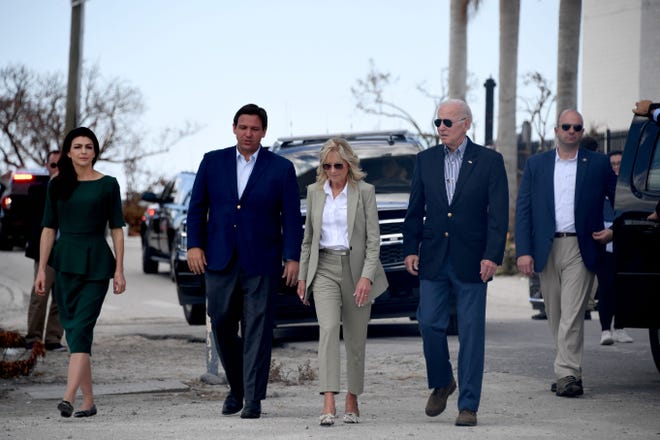 Casey DeSantis, Florida Gov. Ron DeSantis, first lady Jill Biden and President Joe Biden walk to meet with local residents impacted by Hurricane Ian in Fort Myers, Florida, on Oct. 5, 2022.