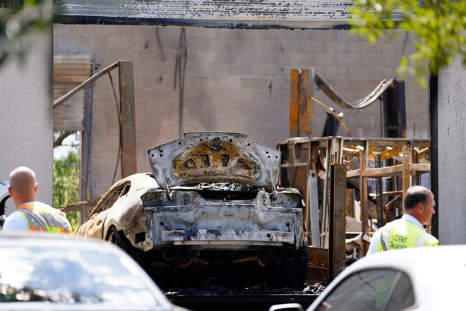 St. Lucie County Fire Rescue firefighters extinguished a fire that started at Hades Motorsports in the 700 block of Southwest Grove Avenue on Thursday, Oct. 6, 2022, in Port St. Lucie. Three people were injured and transported to a local hospital, according to Brenda Stokes, fire rescue spokesperson.