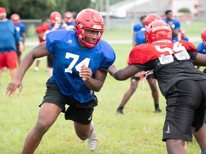 Jonathan Daniels (74) runs a drill during football practice at Pine Forest High School in Pensacola on Thursday, Aug. 18, 2022.