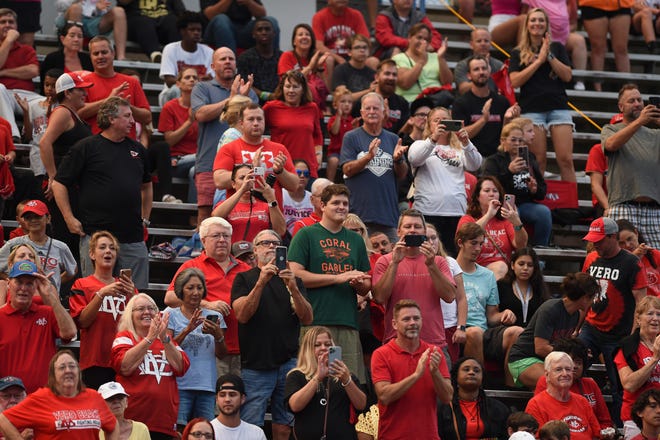 Gov. Ron DeSantis, his wife Casey DeSantis and their three children wave to a crowd at Shark Stadium on Friday, Sept. 23, 2022, before Vero Beach played Miami Palmetto. The football game, originally to be held at Billy Living’s Football Field, was moved to Shark Stadium due to the conditions of Vero's field.