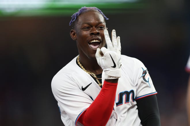 Apr 17, 2022; Miami, Florida, USA; Miami Marlins second baseman Jazz Chisholm Jr. (2) reacts after sliding into third base against the Philadelphia Phillies in the second inning at loanDepot Park. Mandatory Credit: Nathan Ray Seebeck-USA TODAY Sports