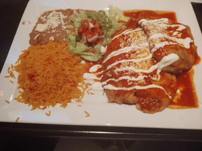 The Chiles Rellenos platter held two cheese-stuffed, egg-battered Poblano peppers, nestled beside rice and beans and a La Bandera salad.