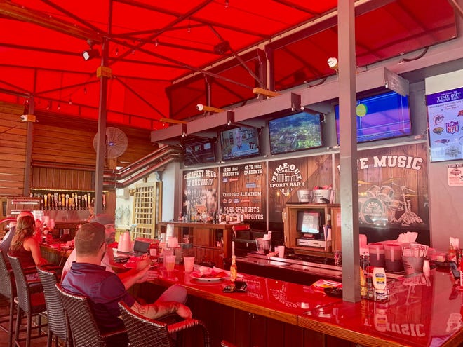 Time Out Sports Bar Plus in Cocoa Village has a spacious, covered patio and lots of TVs.