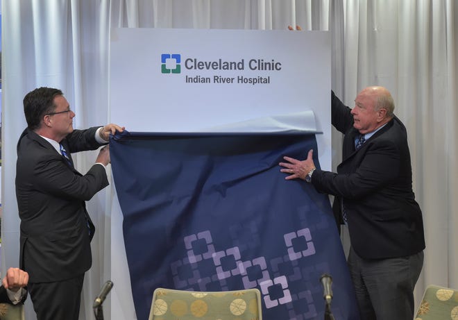 Dr. Gregory Rosencrance, left, president of Cleveland Clinic Indian River Hospital, and Wayne Hockmeyer, board member, Cleveland Clinic Indian River Hospital, unveil their new name during a news conference at Cleveland Clinic Tradition Hospital in Port St. Lucie, Wednesday, Jan. 9, 2019, announcing the new names of Indian River Medical Center and Martin Health System. Cleveland Clinic's performance has become an issue in the 2022 Indian River County Hospital District race.
