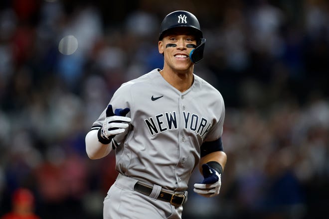 Yankees right fielder Aaron Judge rounds the bases after hitting his 62nd home run of the season Tuesday in Arlington, Texas to break the American League record held by Roger Maris since 1961.