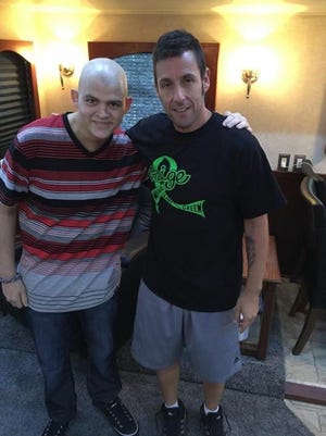 Members of Adam Sandler's team heard about Gaige Robbins' wish to meet the actor, so Sandler made it happen. Here he is sporting a "Team Gaige" T-shirt.