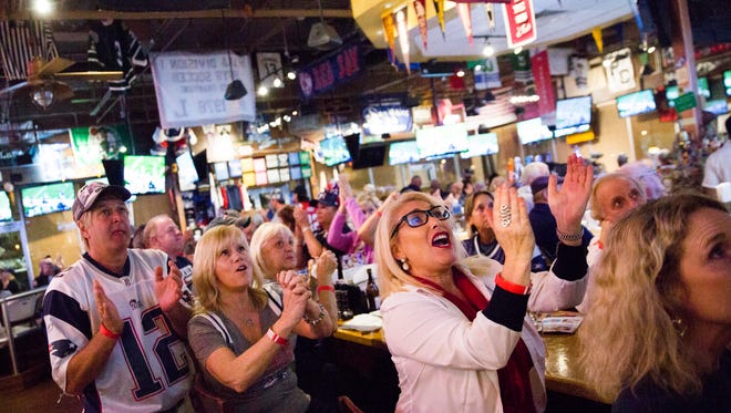 Patriots fans cheer for their team during Super Bowl LII against the Philadelphia Eagles on Sunday, February 4, 2018 at Foxboro Sports Tavern in Naples.