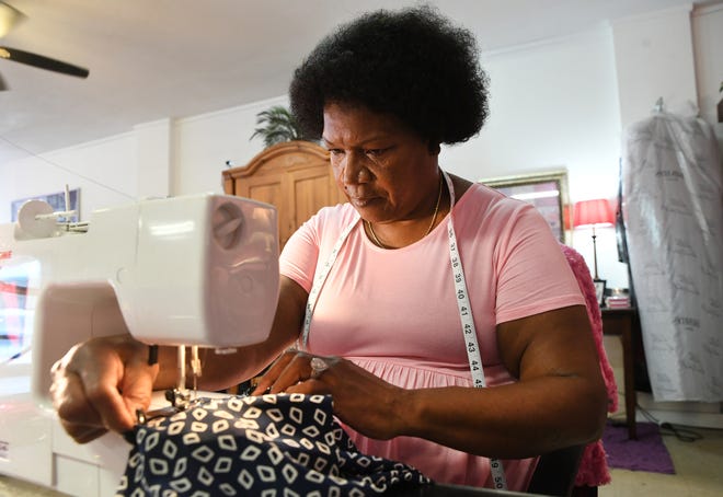 Cynthia Ashley, of Fort Pierce, works on a customer's clothing at her business, Cynthia's Alterations & More, on Avenue D on Tuesday, Aug. 9, 2022, in Fort Pierce. Ashley was able to grants from the City of Fort Pierce and Allegany Franciscan Ministries to restart her business. "If it wasn't for that grant money I wouldn't be here," Ashley said.