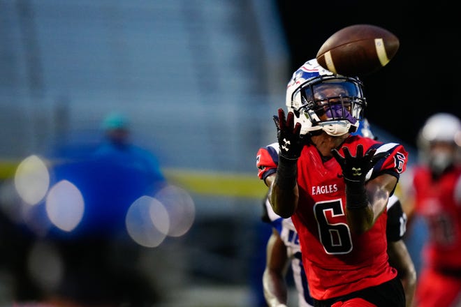 Centennial’s Isaiah Roberts (6) receives a pass to score a touchdown against Heritage in a high school football game on Friday, Sept. 9, 2022 at South County Stadium in Port St. Lucie. Centennial won 30-0.