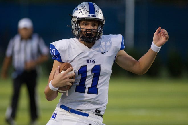 Bartram Trail junior quarterback Riley Trujillo (11) rushes the ball in a game against Lincoln on Sept. 15, 2022, at Gene Cox Stadium. The Bears won 24-7.