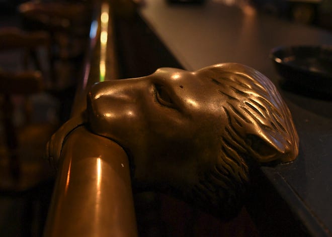 Brass lion heads are seen along the bar rail at the Boozgeois Saloon in Fort Pierce. "They have been here since the place opened in the original location, we're talking about 1964 I think," said bar manager Kyla Wickard. "It's all brass rails, brass lion heads, they're old."