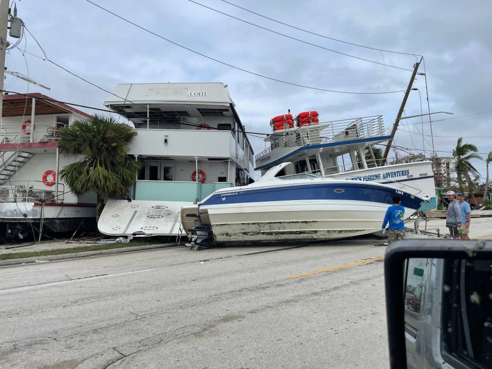 A boat ended up sideways on this road along Fort Myers Beach. It was the result of the devastating storm surge from Hurricane Ian.