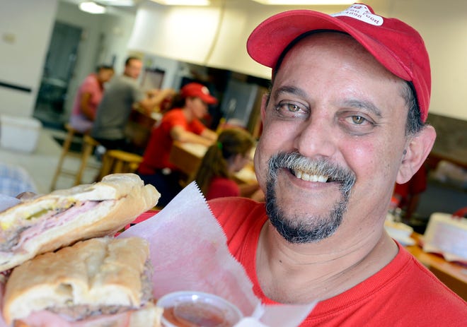Owner Jose Baserva with a Cuban sandwich on July 23, 2012, at his Jose's Real Cuban Food restaurant located at 8799 Cortez Road West in Bradenton.