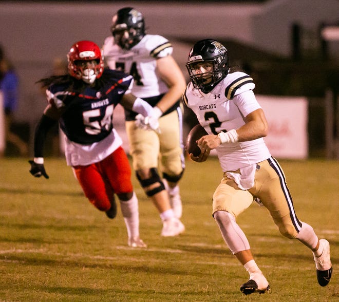 Buchholz Bobcats Creed Whittemore (2) scrambles for yards. Vanguard High School hosted Buchholz High School at Booster Stadium in Ocala, FL on Friday, September 23, 2022.  [Doug Engle/Ocala Star Banner]