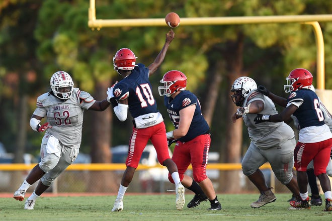 Miche Estime (10) of Forest Hill High School throws the ball during a preseason game against Westwood Academy at Lawnwood Stadium in Fort Pierce on Friday, August 19, 2022.