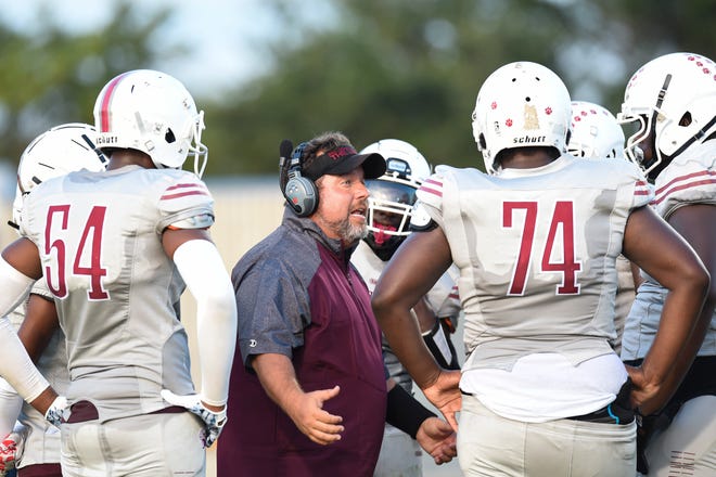 Chris Kokell, head football coach of Fort Pierce Westwood Academy, speaks to his team during a preseason opener against Forest Hill High School in Fort Pierce on Friday, August 19, 2022.