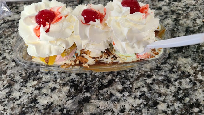 Sweet Annie’s banana split serves up three scoops and toppings, whipped cream and cherries.