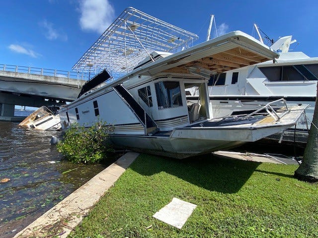 Boats damaged and washed ashore at the Fort Myers Yacht Basin and Centennial Park from Hurricane Ian.