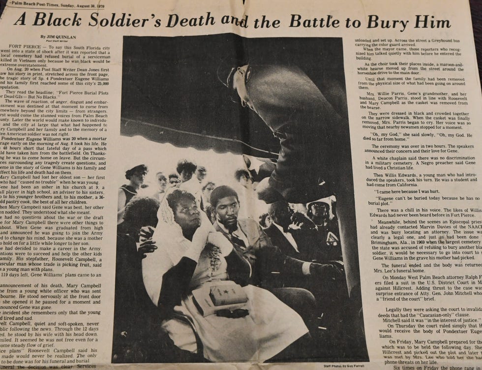 A newspaper story from the Palm Beach Post on Sunday, Aug. 30, 1970, shows the parents of Pondextuer Williams, his mother Mary  Campbell (left) and stepfather Roosevelt Campbell, as they are presented his flag during the funeral service.