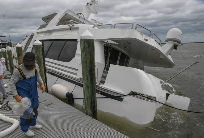 Boats and docks at the Causeway Cove Marina were damaged or sunk as seen on Thursday, Sept, 29, 2022, in Fort Pierce. Unexpected strong wind gusts from Hurricane Ian caused damaged to boats and docks at Causeway Cove.
