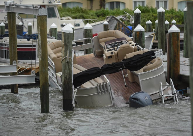 Boats and docks at the Causeway Cove Marina were damaged or sunk as seen on Thursday, Sept, 29, 2022, in Fort Pierce. Unexpected strong wind gusts from Hurricane Ian caused damaged to boats and docks at Causeway Cove.